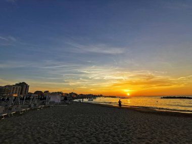 beach in Italy's Romagna Riviera at sunset. High quality photo