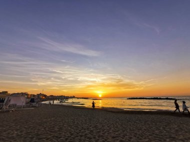 beach in Italy's Romagna Riviera at sunset. High quality photo