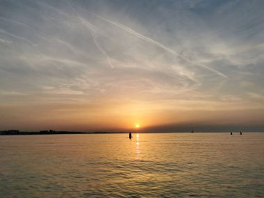 reflection of the sea on the waves at sunset. High quality photo