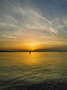 reflection of the sea on the waves at sunset. High quality photo