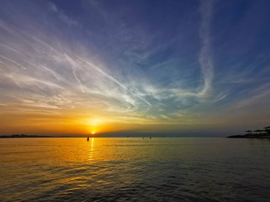 reflection of the sea on the waves at sunset. High quality photo