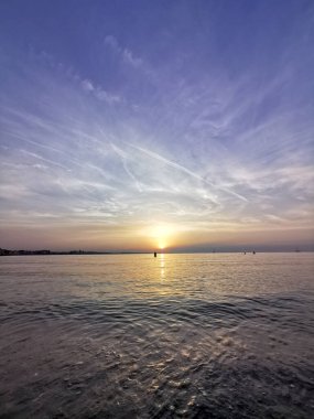 reflection of the sea on the waves at sunset. High quality photo