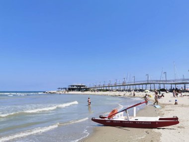 Cattolica beach in Rimini in Italy with waves. High quality photo clipart