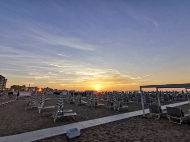 Cattolica beach in establishment with deck chairs and umbrellas. High quality photo