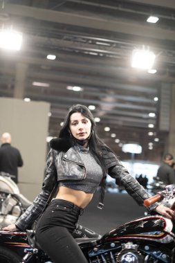 Verona, Italy - 2018 01 12 : MBE Verona Bike Expo Bike and Custom car exibituon - Black Hair Model girl. High quality photo