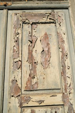 old wooden antique door with ruined paint. High quality photo