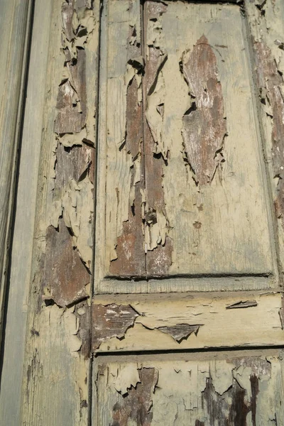 old wooden antique door with ruined paint. High quality photo