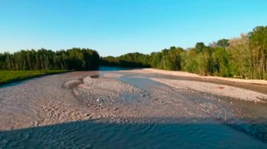 flood of the Enza river in Montecchio Emilia Italy at sunset. High quality 4k footage