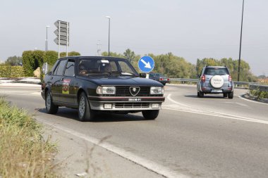 Bibbiano-Reggio Emilia Italy - 07 15 2015 : Free rally of vintage cars in the town square Alfa Romeo Alfetta 90 quadrifoglio verde. High quality photo