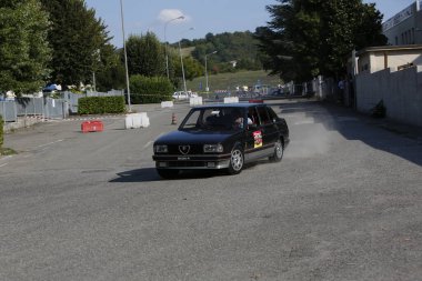 Bibbiano-Reggio Emilia Italy - 07 15 2015 : Free rally of vintage cars in the town square Alfa Romeo Alfetta 90 quadrifoglio verde. High quality photo