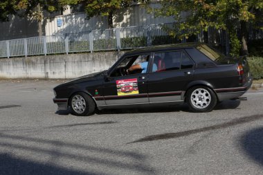 Bibbiano-Reggio Emilia Italy - 07 15 2015 : Free rally of vintage cars in the town square Alfa Romeo Alfetta 90 quadrifoglio verde. High quality photo