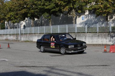 Bibbiano-Reggio Emilia Italy - 07 15 2015 : Free rally of vintage cars in the town square Alfa Romeo Alfetta 90 quadrifoglio verde. High quality photo