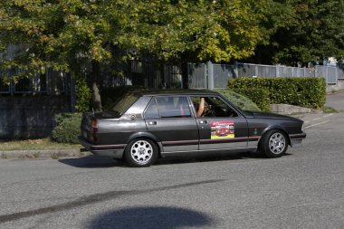 Bibbiano-Reggio Emilia Italy - 07 15 2015 : Free rally of vintage cars in the town square Alfa Romeo Alfetta 90 quadrifoglio verde. High quality photo