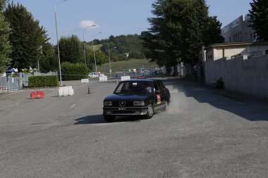 Bibbiano-Reggio Emilia Italy - 07 15 2015 : Free rally of vintage cars in the town square Alfa Romeo Alfetta 90 quadrifoglio verde. High quality photo