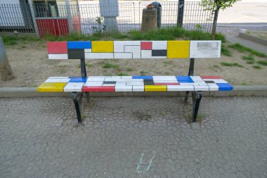Turin, Italy - 2022 06 04: piazza Moncenisio Mau bench decorated with style of famous artists Piet Mondrian. High quality photo