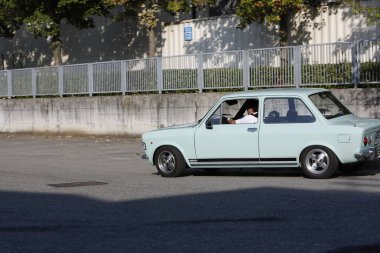 Bibbiano-Reggio Emilia Italy - 07 15 2015 : Free rally of vintage cars in the town square Fiat 128 Rally. High quality photo