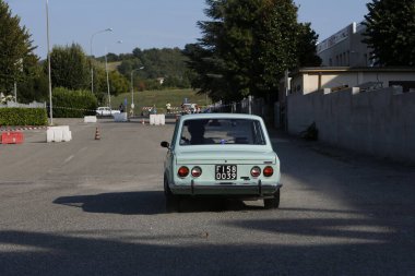 Bibbiano-Reggio Emilia Italy - 07 15 2015 : Free rally of vintage cars in the town square Fiat 128 Rally. High quality photo