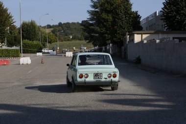 Bibbiano-Reggio Emilia Italy - 07 15 2015 : Free rally of vintage cars in the town square Fiat 128 Rally. High quality photo