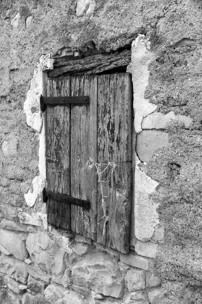ancient wooden window on stone wall. High quality photo