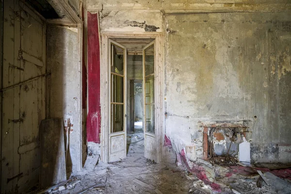 doors onto hall in large abandoned house in the abandoned house. High quality photo
