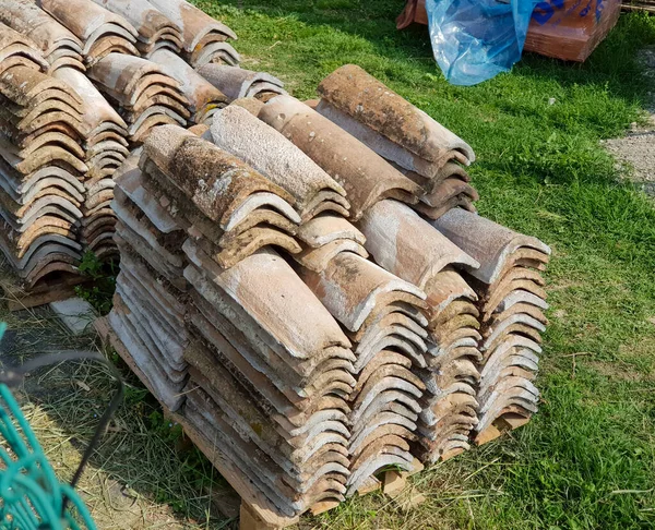 stock image antique stacked terracotta curved tile. High quality photo