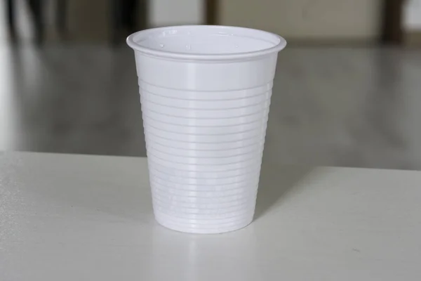 white plastic cup on white background. High quality photo
