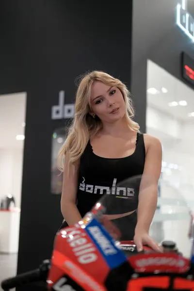 stock image Milano, Italy - 2021 11 27: Eicma Milano Bike Expo beautiful blonde girl. High quality photo