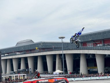Milano, Italy - 2023 11 23: Eicma Milano Bike Expo freestyle motocross jumps and figures. High quality photo clipart
