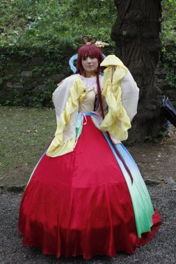 Lucca, Italy - 2018 10 31 : Lucca Comics free cosplay event around city princess in red dress. High quality photo clipart