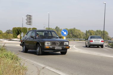 Bibbiano-Reggio Emilia Italy - 07 15 2015 : Free rally of vintage cars in the town square Alfa Romeo Alfasud. High quality photo clipart