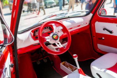 Bibbiano-Reggio Emilia Italy - 07 15 2015 : Free rally of vintage cars in the town square Fiat 500 Abarth interior. High quality photo clipart