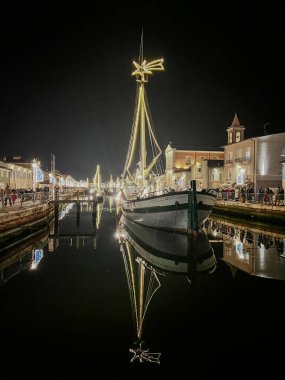 Christmas Lights on Historic Boats in Cesenatico's Canal. High quality photo clipart