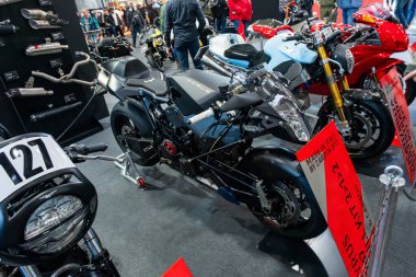 Verona, Italy : 2025 01 24 MBE Motor Bike Expo Custom Motorbike and Custom Muscle Car Event Race Motorcycle on Display at the Track. High quality photo clipart