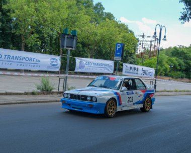 Salsomaggiore Terma Parma, Italy : 2025 08 03 An iconic BMW M3 E30 with classic M Sport livery, racing in a historic car rally. . High quality photo