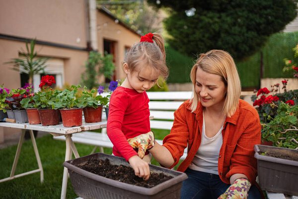 Joyful moments shared while gardening on a warm day.
