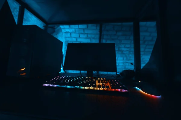 Gaming computer in a dark neon room. High quality photo