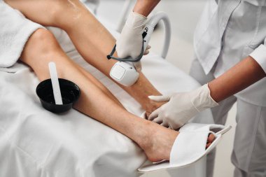 Laser epilation of legs in a beauty salon. High quality photo