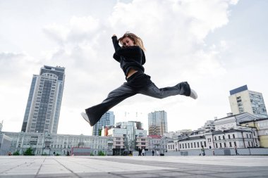 A young woman in a jump during a dance. High quality photo