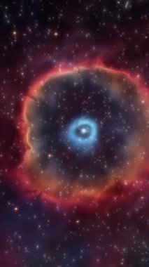 Helix Bulutsusu 'nun nefes kesici güzelliğine tanık olun. Canlı renkler ve astronomik bir fenomen sırasında yıldızlarla dolu bir arkaplan sergiliyor..