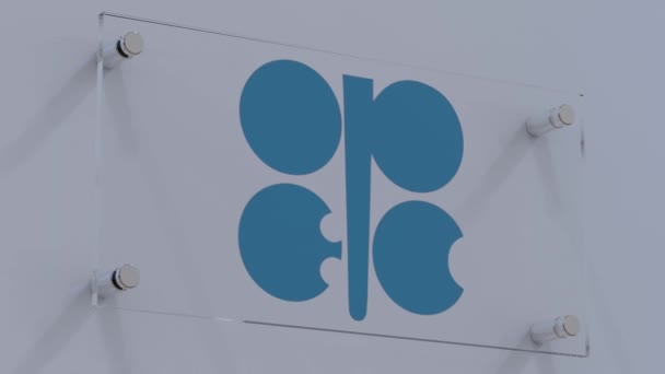 石油輸出国機構 スポットライト付きウォールプレート上のOpecボールドフラッグロゴ — ストック動画