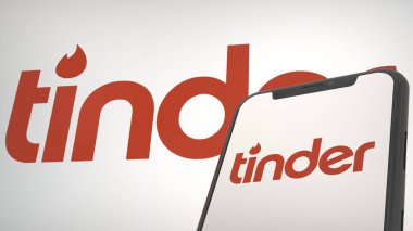 Mobil ekran ve arkaplan editoryel Tinder uygulama logosu