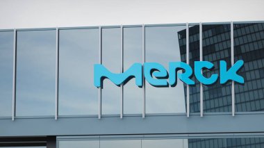 Merck KGaA Stock data presented on the logo of the office facade editorial clipart