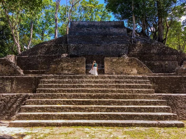 Female tourist exploring Cahal Pech Mayan Ruin, San Ignacio, Belize