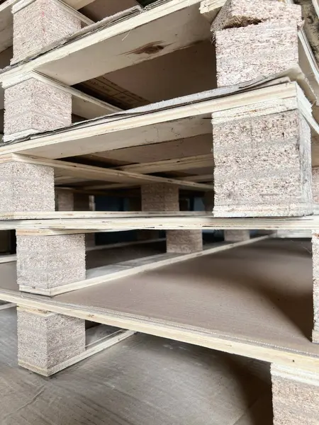 Wooden pallets stacked in a industrial architecture 
