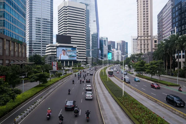 stock image Slow traffic at Sudirman stret in the morning weekday. Office building or skyscrapers in the background