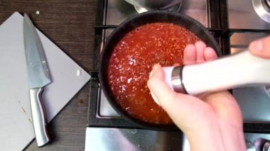 cooking at domestic kitchen overhead view red tomatoes sauce on frying pan healthy food