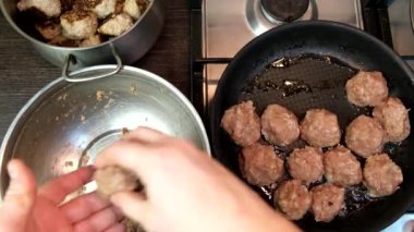 overhead view of frying meatballs on pan domestic food pov