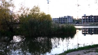 construction site building apartment near lake copy space