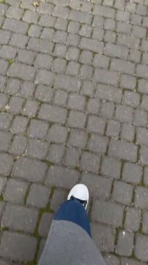 first person view walking by neighborhood with beautiful houses at autumn season