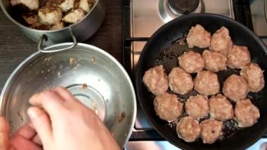 overhead view of frying meatballs on pan domestic food pov